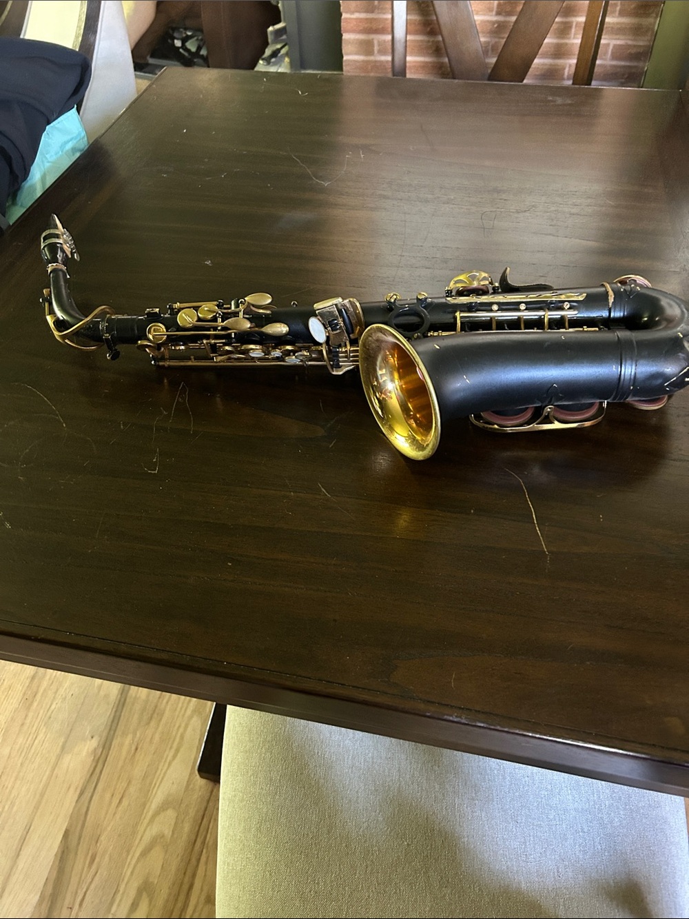Black and gold saxophone dented